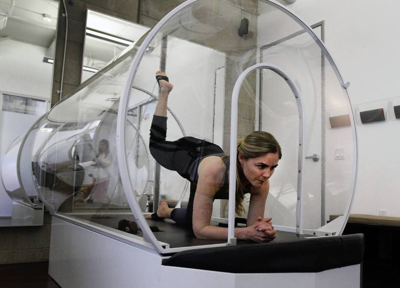 Trainer Brenda Papiernik demonstrates the heated exercise chamber at Iobella spa in Santa Monica.