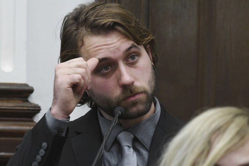 FILE - Gaige Grosskreutz watches video of the shooting as he testifies about being shot in the right bicep during Kyle Rittenhouse's trial at the Kenosha County Courthouse in Kenosha, Wis., on Nov. 8, 2021. Grosskreutz, who survived a shooting by Kyle Rittenhouse that left two others dead during a Wisconsin protest in 2020, has filed a secret petition to change his legal name because of what he now says was continued harassment related to the case. (Mark Hertzberg/Pool Photo via AP, File)