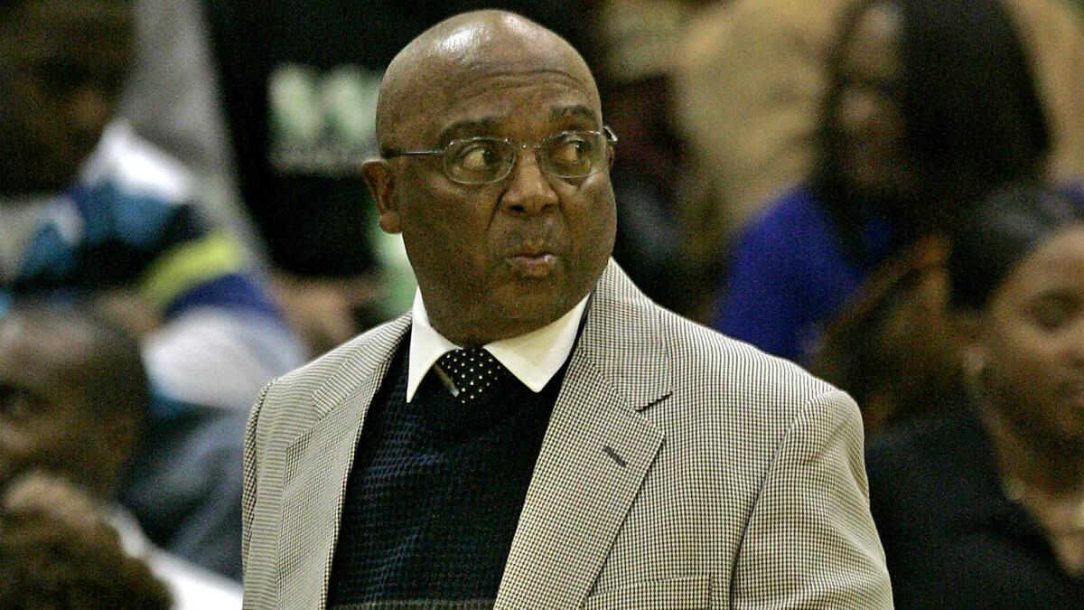 Legendary coach Willie West of Crenshaw watches a game against Dorsey during his final season in 2007.