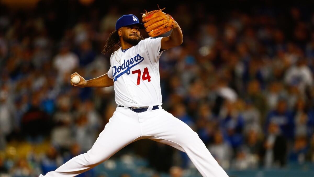 Dodgers relief pitcher Kenley Jansen pitches against the San Francisco Giants.