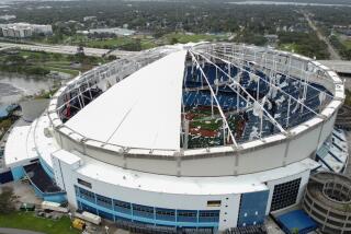 A drone image shows the dome of Tropicana Field which has been torn open due to Hurricane Milton in St. Petersburg, Florida, on October 10, 2024. At least four people were confirmed killed as a result of two tornadoes triggered by Hurricane Milton on the east coast of the US state of Florida, local authorities said Thursday. (Photo by Bryan R. SMITH / AFP) (Photo by BRYAN R. SMITH/AFP via Getty Images)