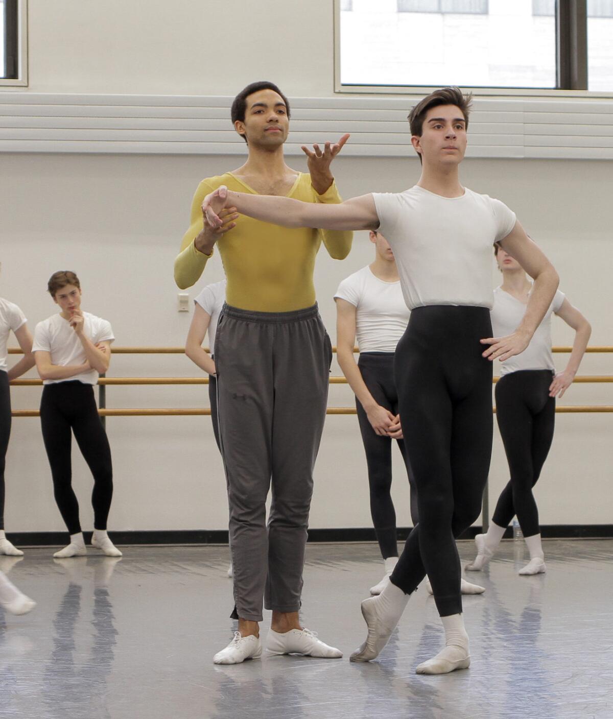 A man teaches a ballet student
