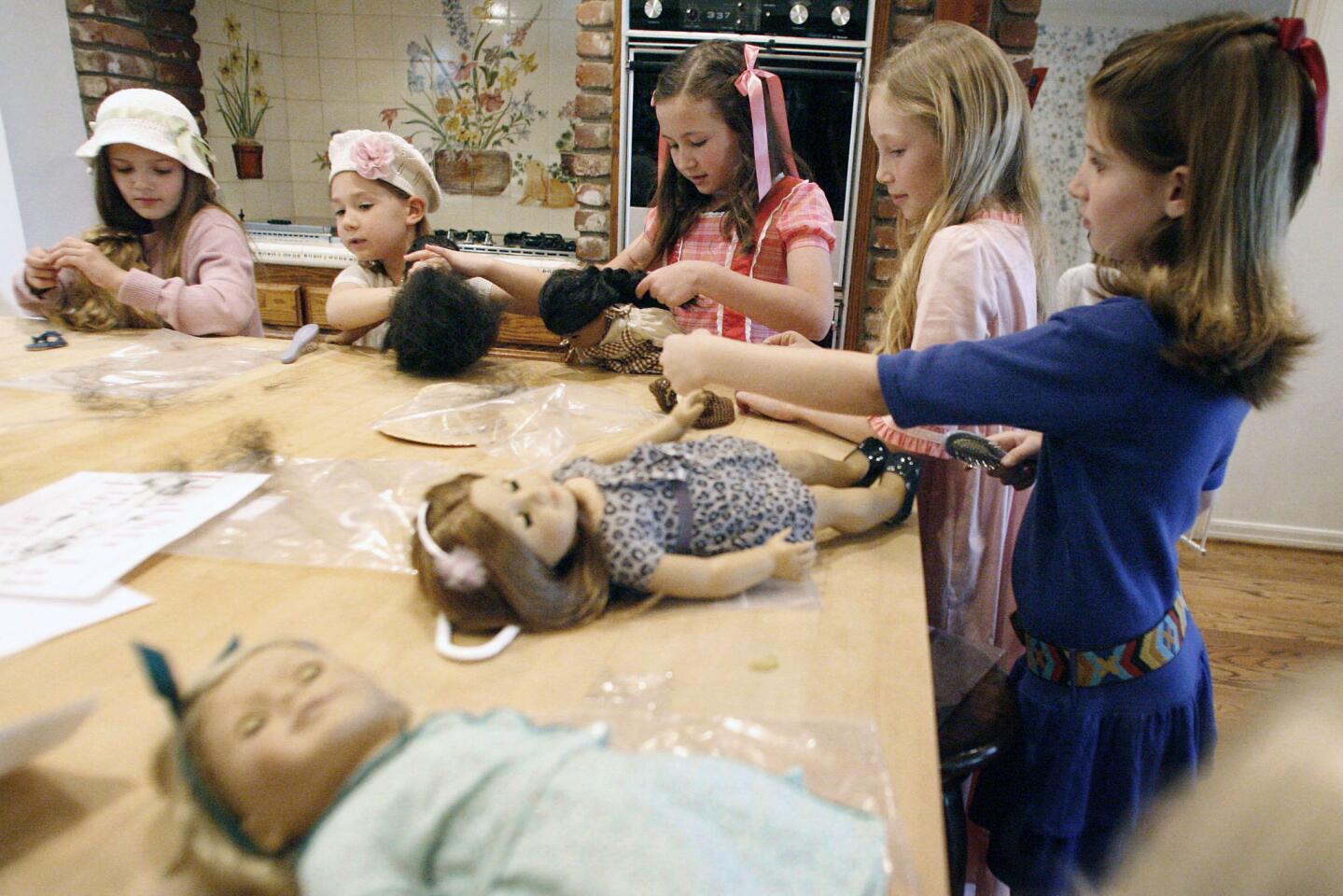 Girls prepare for the American Girl Fashion Show