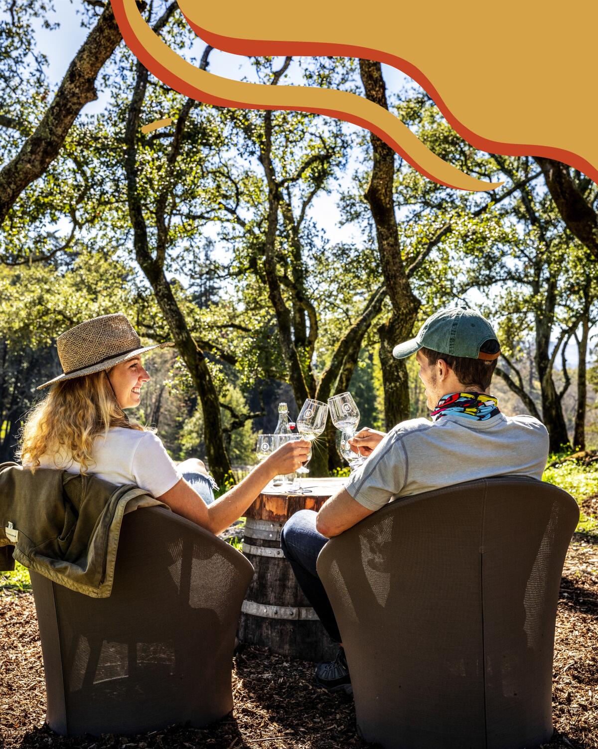 Two people enjoy glasses of wine. 