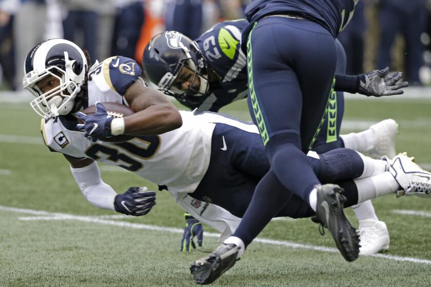 Rams running back Todd Gurley dives for extra yards in the first half.