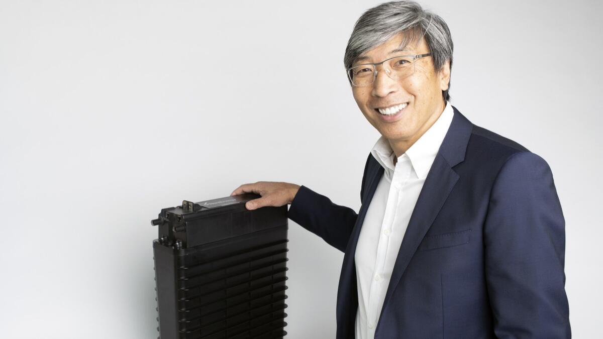 NantEnergy Chairman Patrick Soon-Shiong with his company's rechargeable zinc-air battery cell.