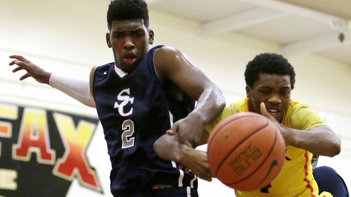 Cody Riley (2), battling Fairfax's Isaiah Ajiboye for a rebound last season, and Sierra Canyon will try to chase down a title this season.