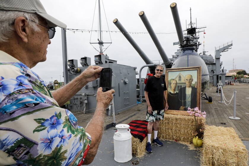 Iowans and their guests having lunch at the 119th annual Iowa Picnic held on the deck of the battleship Iowa on Saturday in San Pedro.