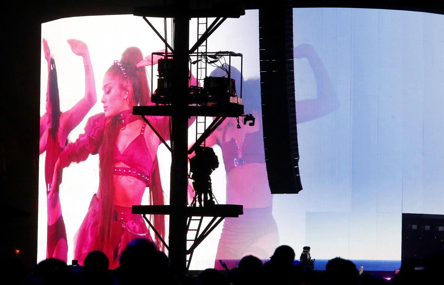 The media were not allowed to photograph the Ariana Grande concert at the Coachella Valley Music and Arts Festival, so Los Angeles Times photographer Luis Sinco instead photographed a camera operator at work recording the concert.