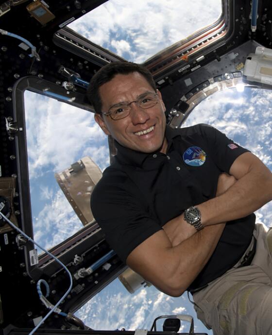astronaut Frank Rubio floating inside the cupola, the International Space Station’s “window to the world.”