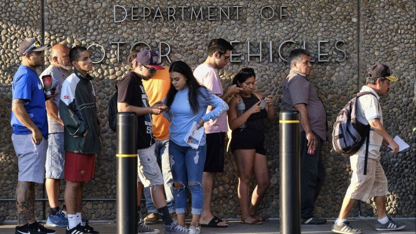 People line up at a California Department of Motor Vehicles location in Van Nuys in 2018.