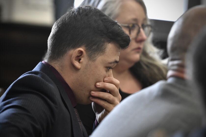 Kyle Rittenhouse puts his hand over his face after he is found not guilty on all counts at the Kenosha County Courthouse in Kenosha, Wis., on Friday, Nov. 19, 2021. The jury came back with its verdict afer close to 3 1/2 days of deliberation. (Sean Krajacic/The Kenosha News via AP, Pool)