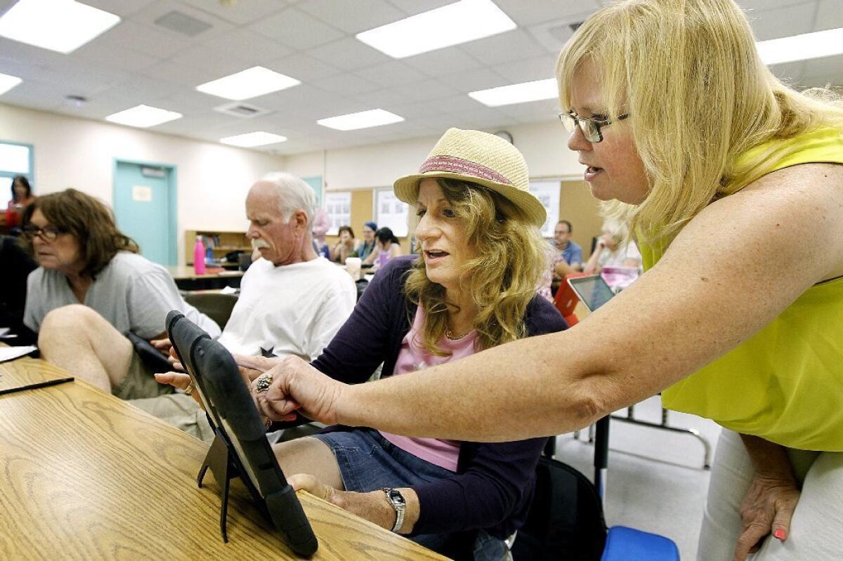 LAUSD teachers attend a training session to improve their skills at using technology in the classroom at Los Angeles Elementary School on July 30.