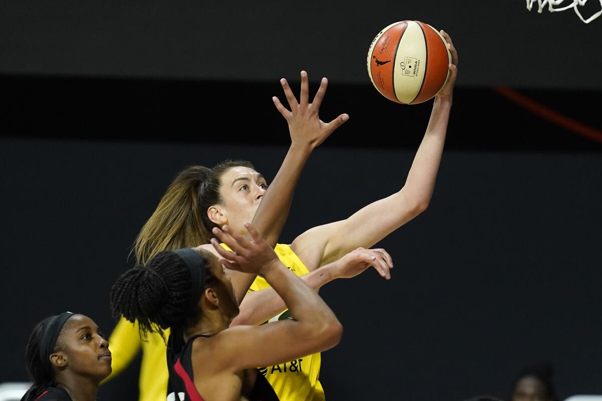 Seattle's Breanna Stewart shoots over Las Vegas' Jackie Young and A'ja Wilson in Game 1 of the WNBA Finals on Oct. 2, 2020.