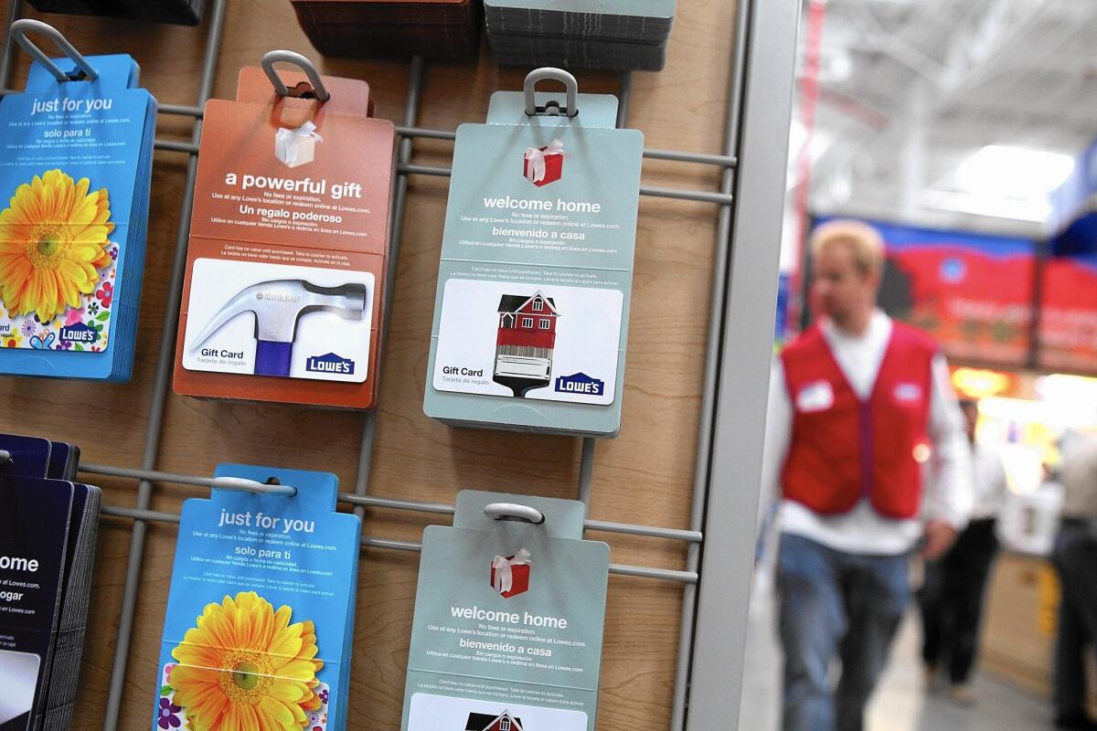 Gift cards for Lowe’s are displayed on a rack at one of the retailer’s stores in San Francisco.