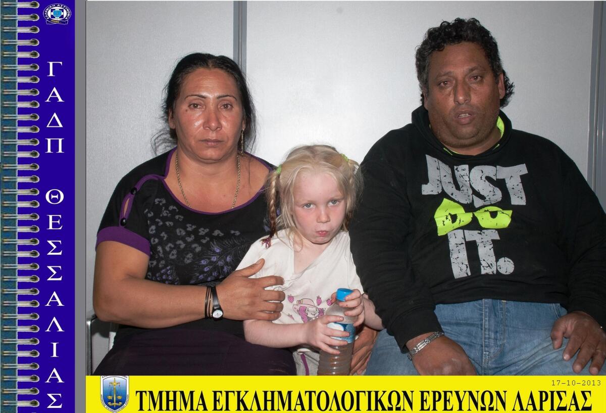 This photo provided by the Hellenic Police shows the Roma couple arrested last week and accused of abducting the child they called Maria, thought to be 5 or 6 years old. A global search for her biological parents has generated thousands of calls and emails about missing children.
