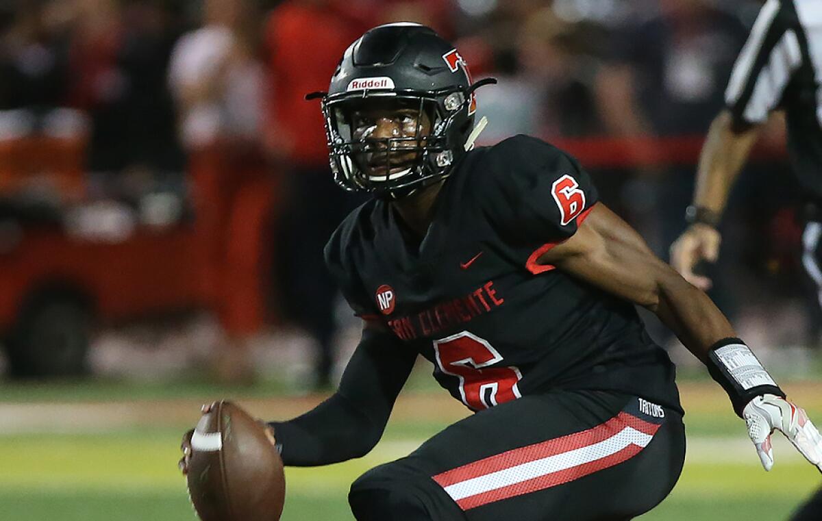 Edison's Trent Fletcher (20) and Kaleb Joyce (48) run down quarterback Nick Billoups for a sack during nonleague game against San Clemente on Friday.