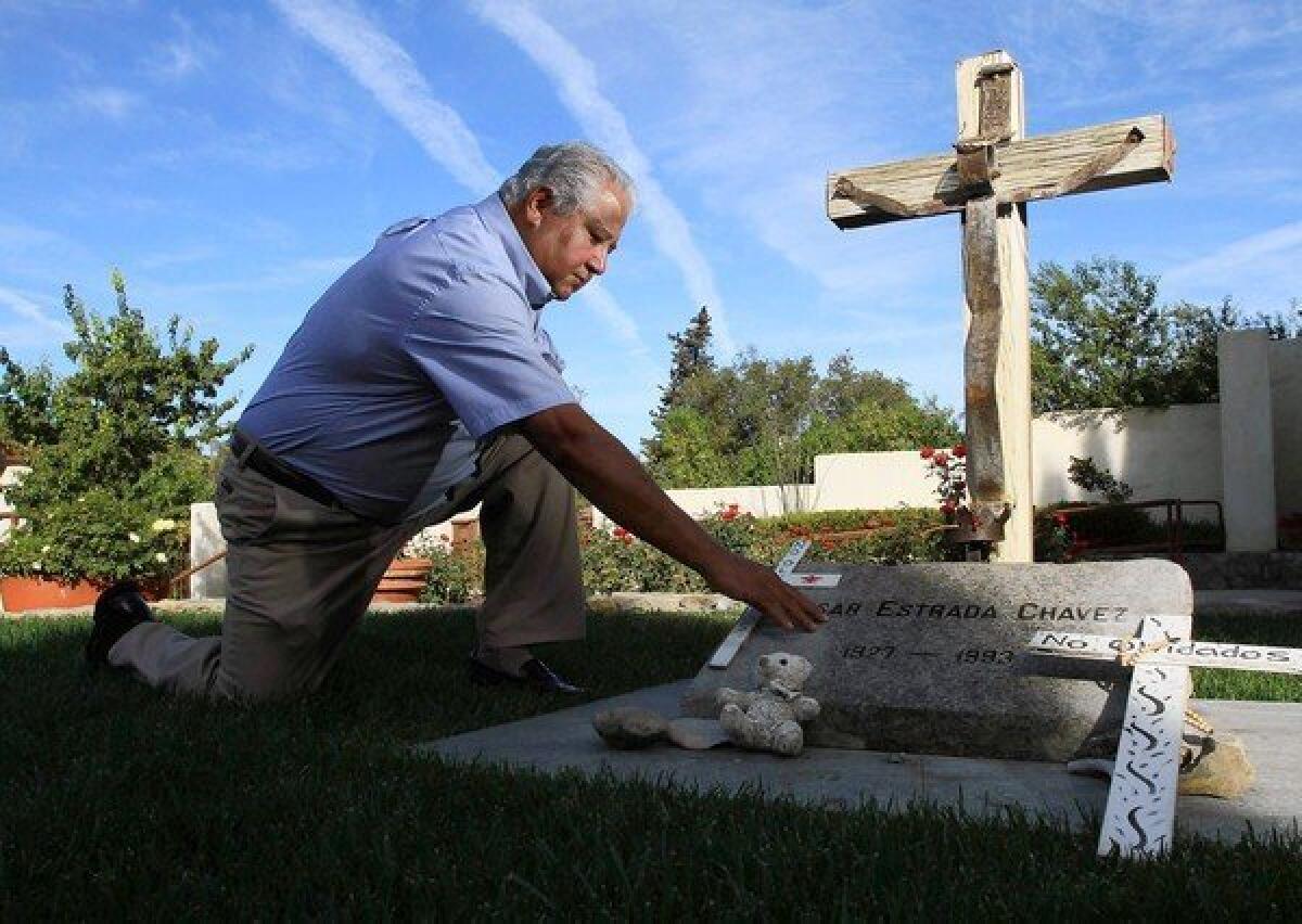 Paul Chavez pays his respects at the grave of his father, labor leader and civil rights activist Cesar Chavez, located at the National Chavez Center in Keene, Calif.