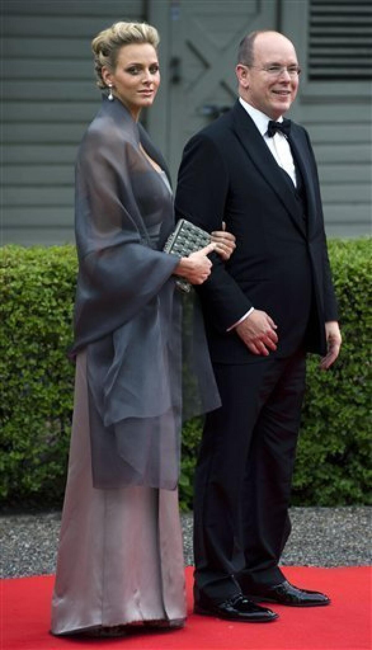 Prince Albert of Monaco, right and Charlene Wittstock arrive at the Swedish Government's dinner at the Eric Ericson Hall in Stockholm, Sweden, Friday, June 18, 2010. Crown Princess Victoria will marry Daniel Westling on Saturday, June 19. (AP Photo/Claudio Bresciani, Scanpix)
