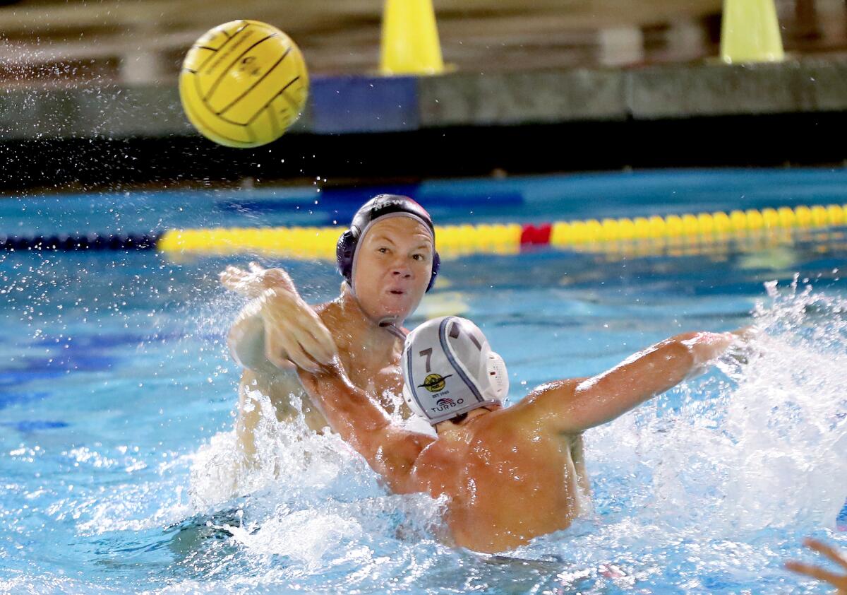 Newport Harbor's Finn LeSieur gets a shot off as Luke Zimmerman (7) of Corona Del Mar defends on Friday night.