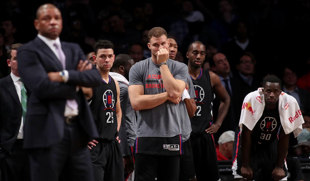 Clippers' Blake Griffin (32) and the bench look on against the Brooklyn Nets in the second half on Tuesday.