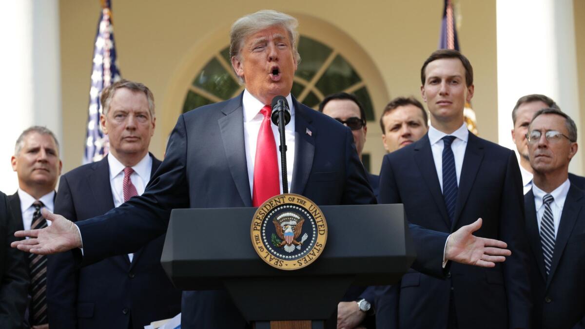 President Trump speaks at a news conference to discuss a revised U.S. trade agreement with Mexico and Canada at the White House on Thursday.