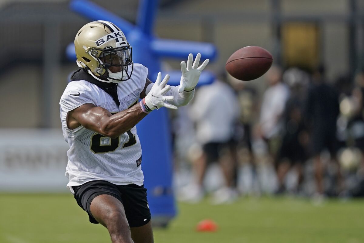 FILE - New Orleans Saints wide receiver Kawaan Baker catches a pass during training camp at the NFL football team's facility in Metairie, La., July 29, 2022. The second-year receiver is facing a six-game suspension for violating the NFL's performance-enhancing drug policy, the league announced Tuesday, Aug. 2. (AP Photo/Gerald Herbert, File)