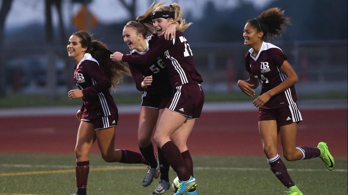 Laguna Beach High's Emerson McCune (56) and Reilyn Turner (54), shown here on Feb. 5, 2018, led the Breakers to a 2-1 win at Lancaster Eastside in the second round of the CIF Southern Section Division 4 playoffs on Tuesday.