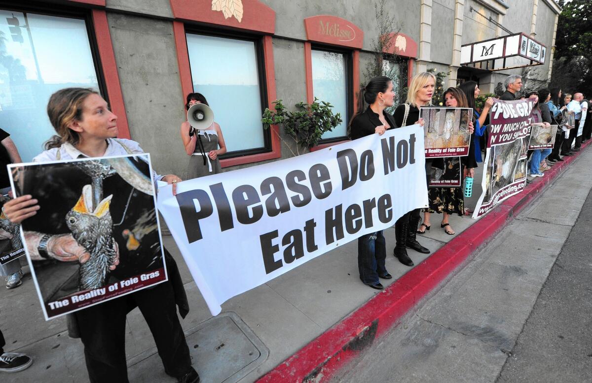 Protesters demonstrate at Melisse in Santa Monica in May. On Wednesday, chef Josiah Citrin said he’d be serving foie gras.