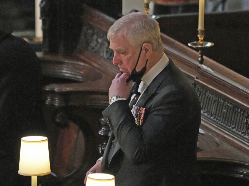 Britain's Prince Andrew inside St. George’s Chapel during the funeral of his father, Prince Philip, at Windsor Castle, Windsor, England, Saturday April 17, 2021. Prince Philip died April 9 at the age of 99 after 73 years of marriage to Britain's Queen Elizabeth II. (Yui Mok/Pool via AP)
