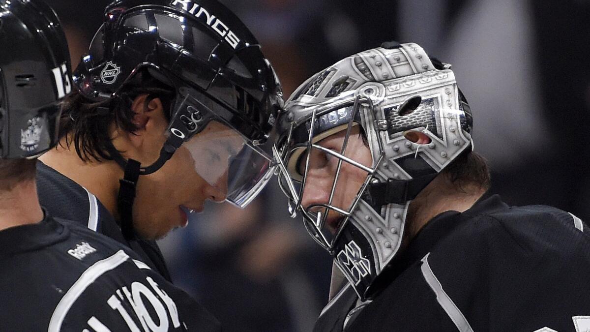 Kings forward Jordan Nolan, left, and goalie Jonathan Quick tap helmets after a 3-2 win over the Tampa Bay Lightning at Staples Center on Monday.