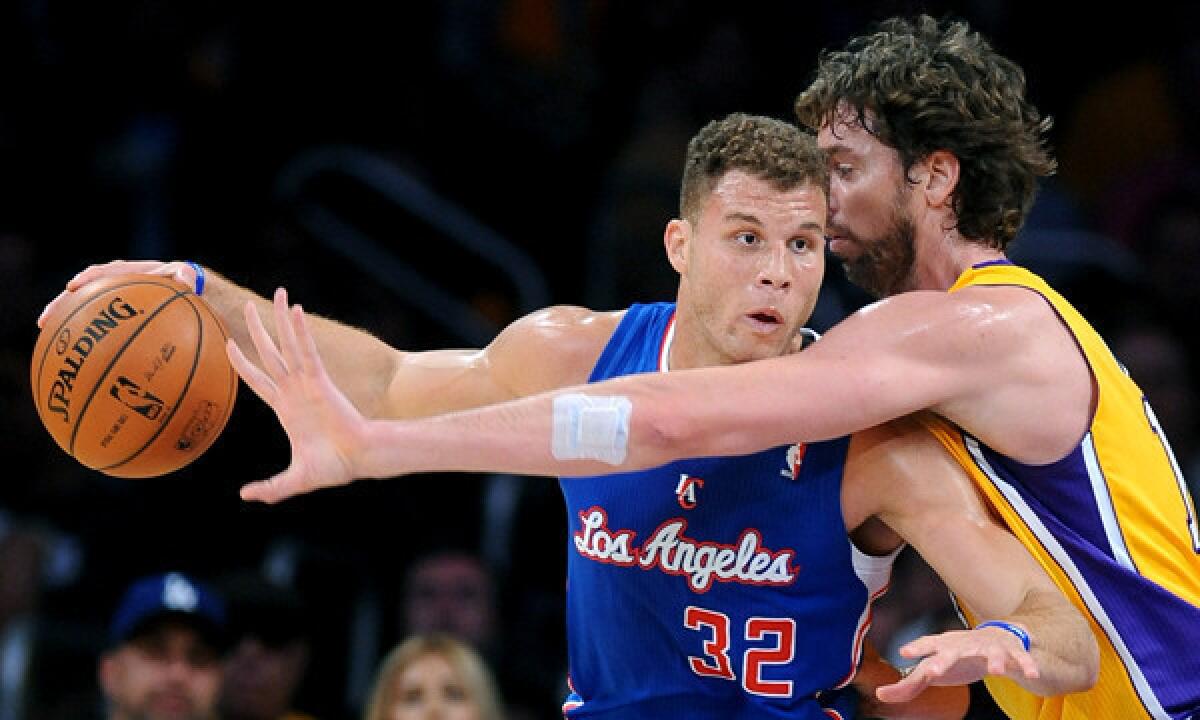 Lakers center Pau Gasol, right, tries to steal the ball from Clippers power forward Blake Griffin during the Lakers' season-opening win Oct. 29.