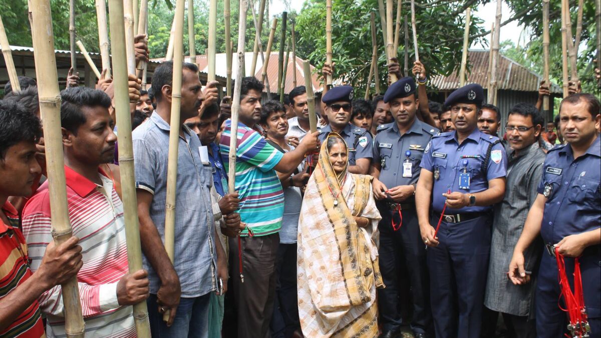 Police in western Bangladesh have armed villagers with bamboo sticks and whistles in an effort to deter Islamist militants from attacking people of minority faiths.