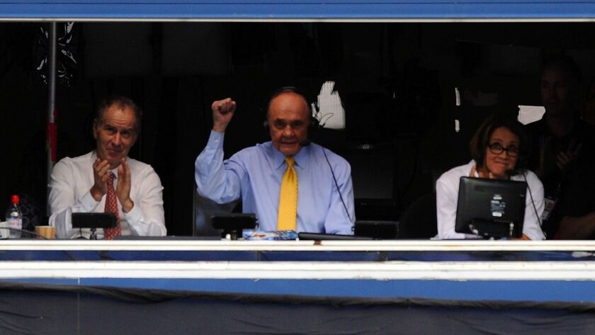 CBS tennis analysts John McEnroe, left, and Mary Carillo, right, listen as the late Dick Enberg calls the 2011 U.S. Open men's final between Rafael Nadal and Novak Djokovic.