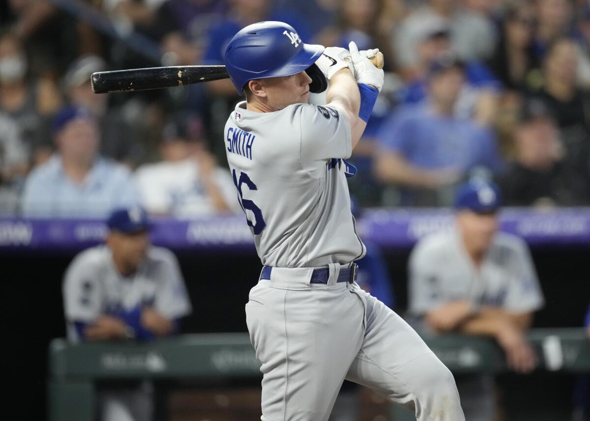 The Dodgers' Will Smith connects for a two-run single in the fifth inning against the Colorado Rockies on July 16, 2021.