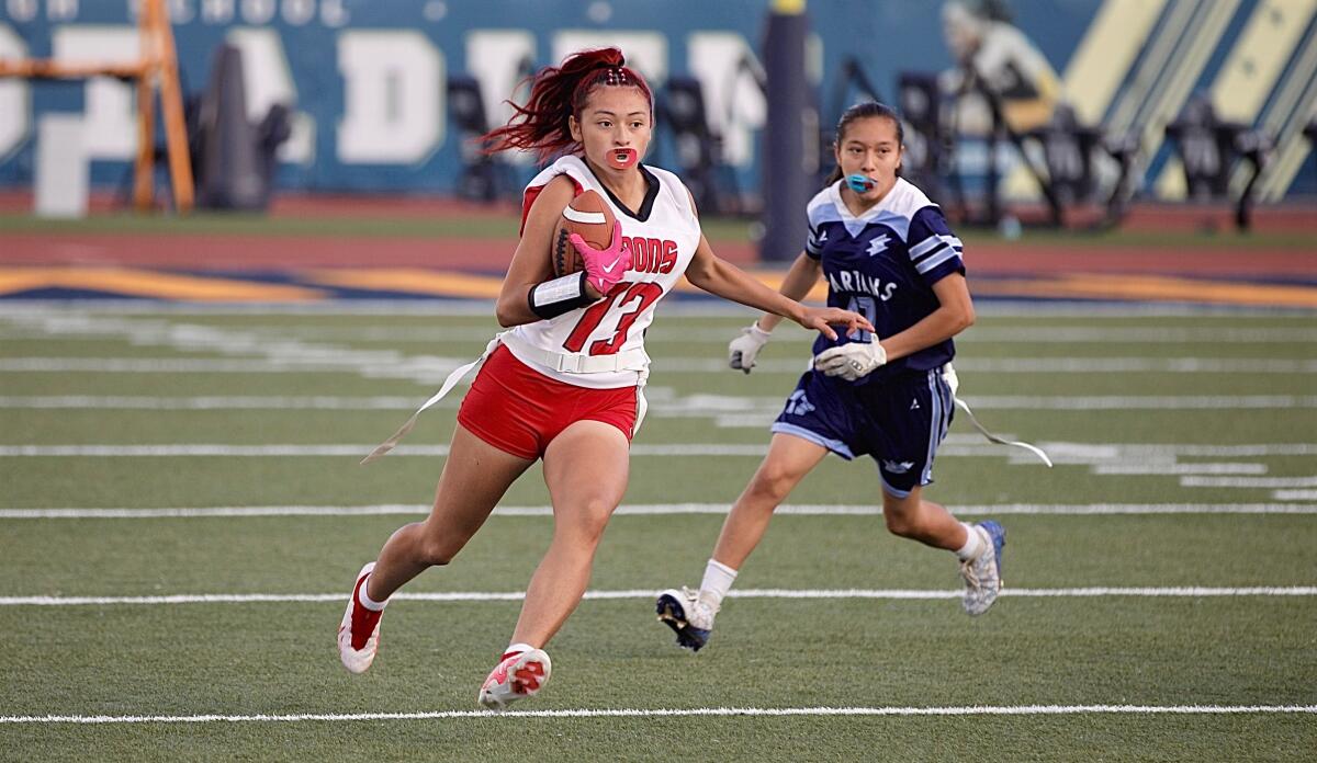 Julianna Sarabia of Verdugo Hills scores a touchdown in the first half of Saturday’s City Division I flag football final.