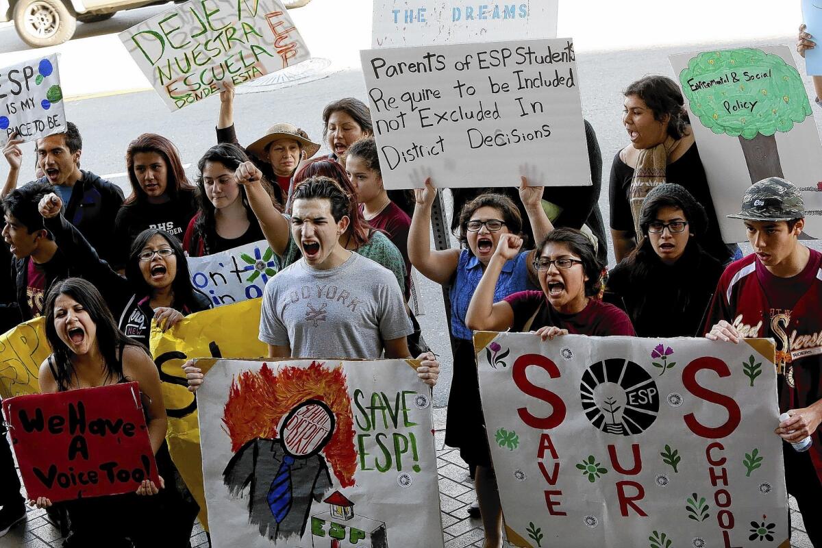 Students protest the possible closure of the Academy of Environmental and Social Policy at Roosevelt High School in February.