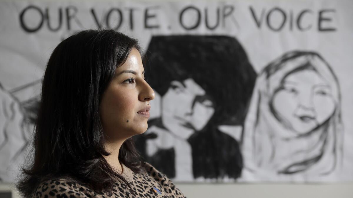 At age 17, Elizabeth Valdivia volunteered as poll worker. This year, she began working with organizations such as the League of Women Voters to bolster the Latino turnout.