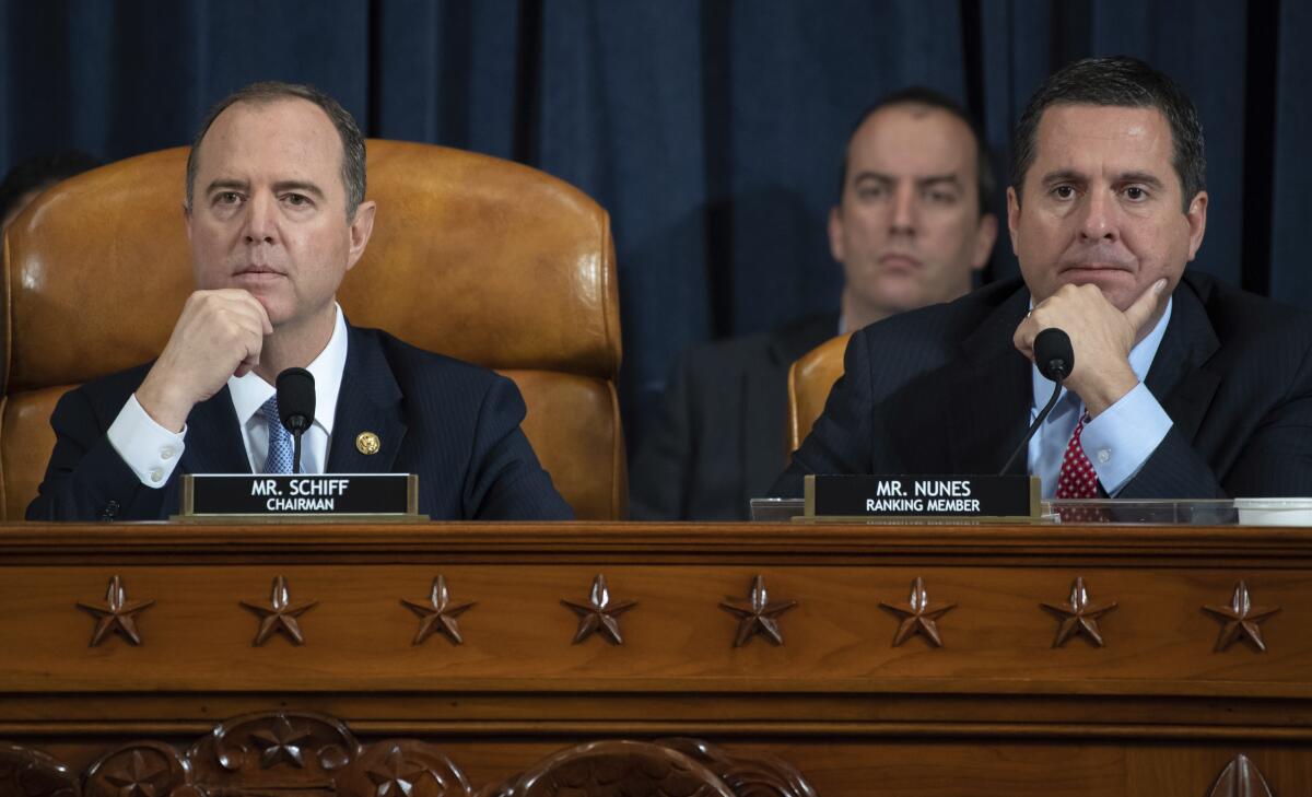 House Intelligence Committee Chairman Adam B. Schiff (D-Burbank), left, and ranking member Rep. Devin Nunes (R-Tulare) at the impeachment hearing Nov. 13.