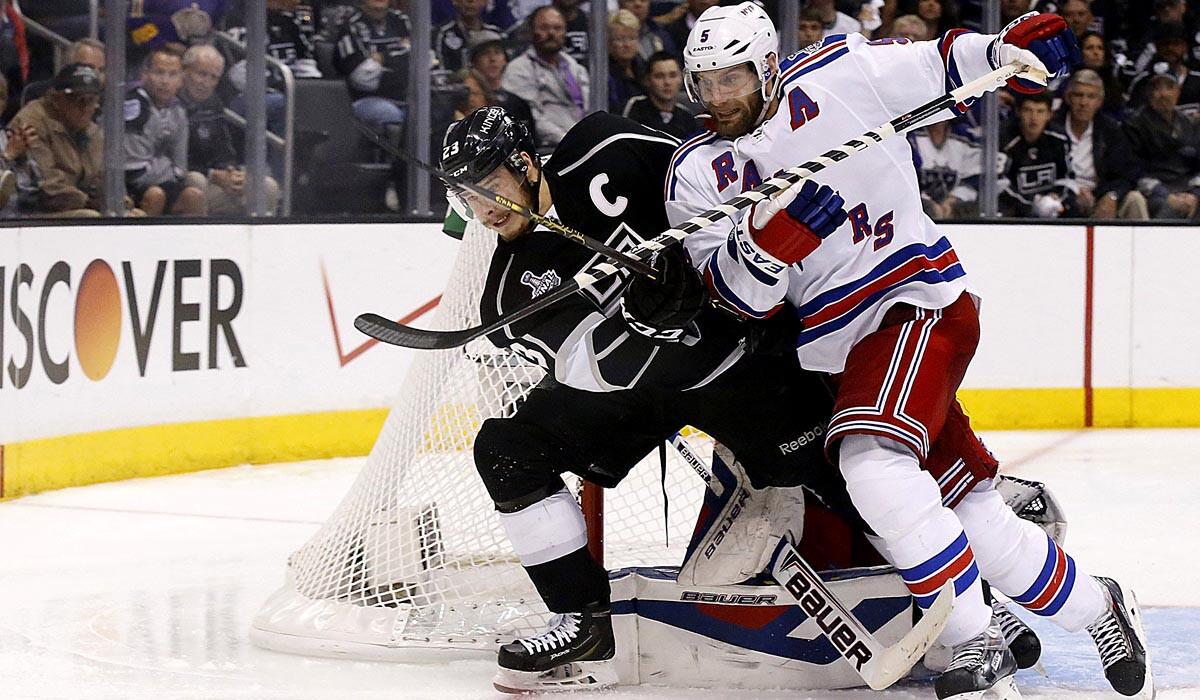 Rangers defenseman Dan Girardi battles Kings captain Dustin Bown for position alongside the crease in the third period of Game 1 on Wednesday night at Staples Center.
