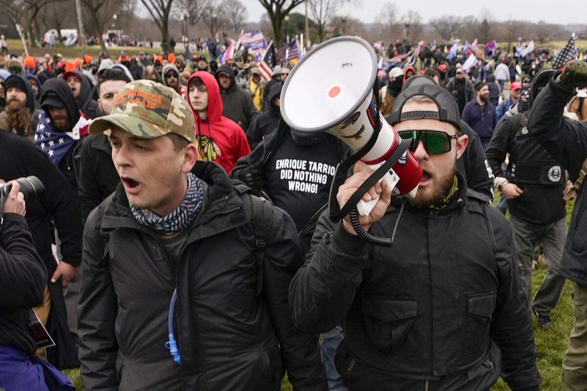 Proud Boys members marching on the Capitol