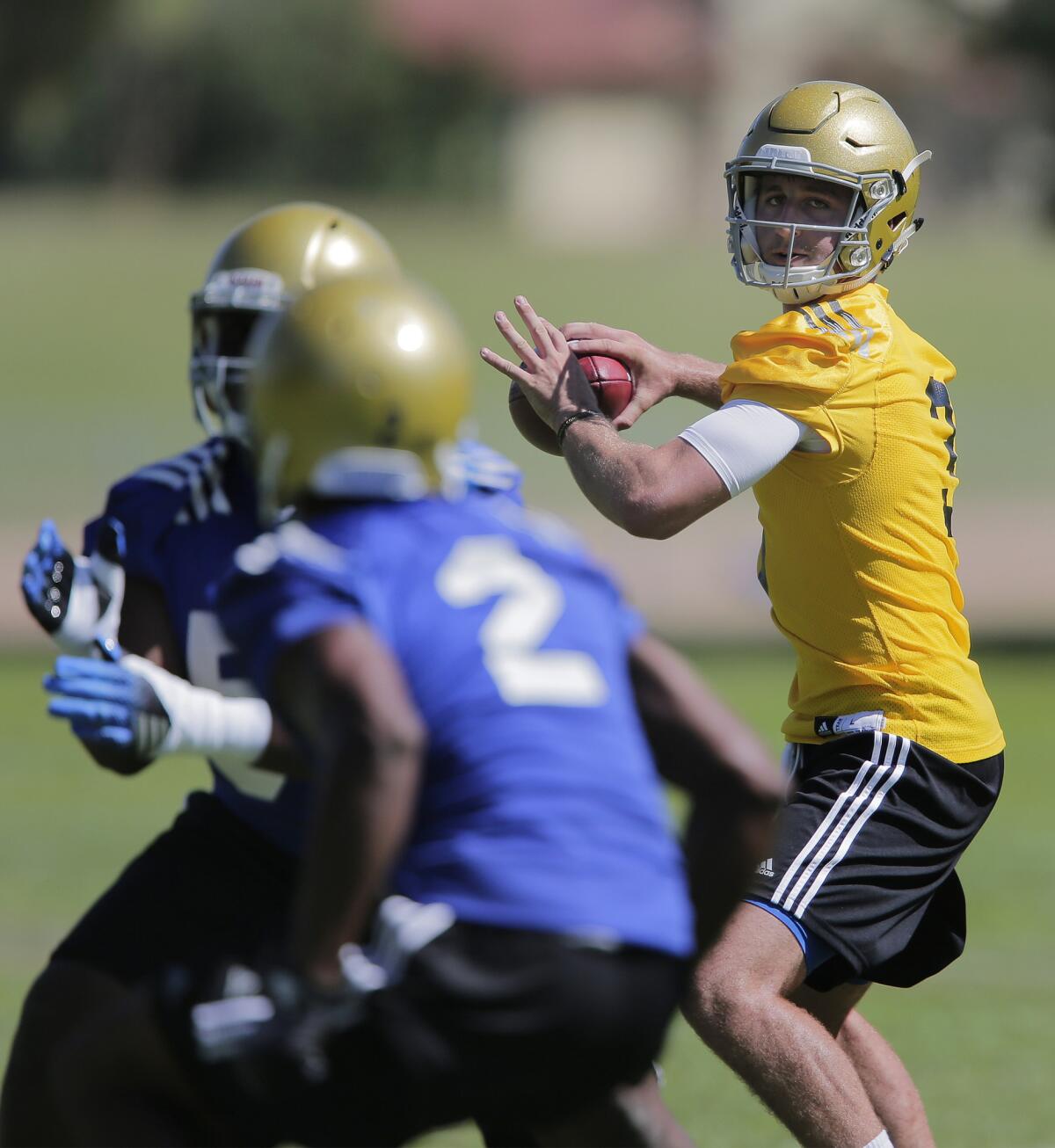UCLA freshman quarterback Josh Rosen looks for an open receiver during the first day of summer camp at Cal State San Bernardino.