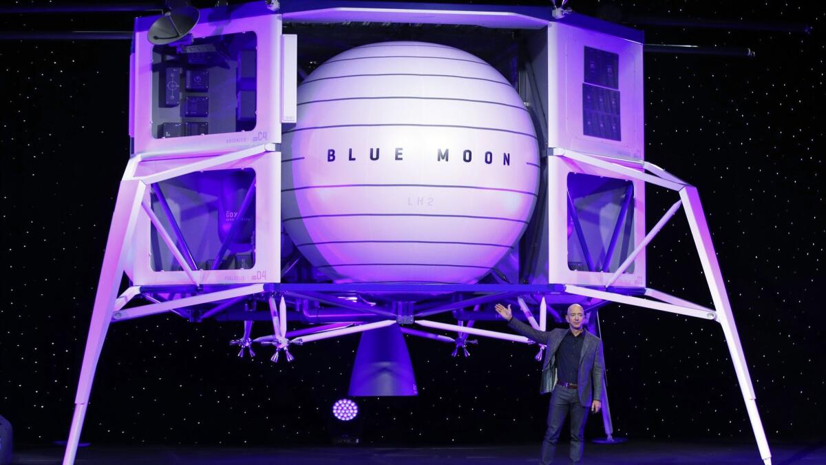 Jeff Bezos speaks in front of a model of Blue Origin's Blue Moon lunar lander in May 2019.