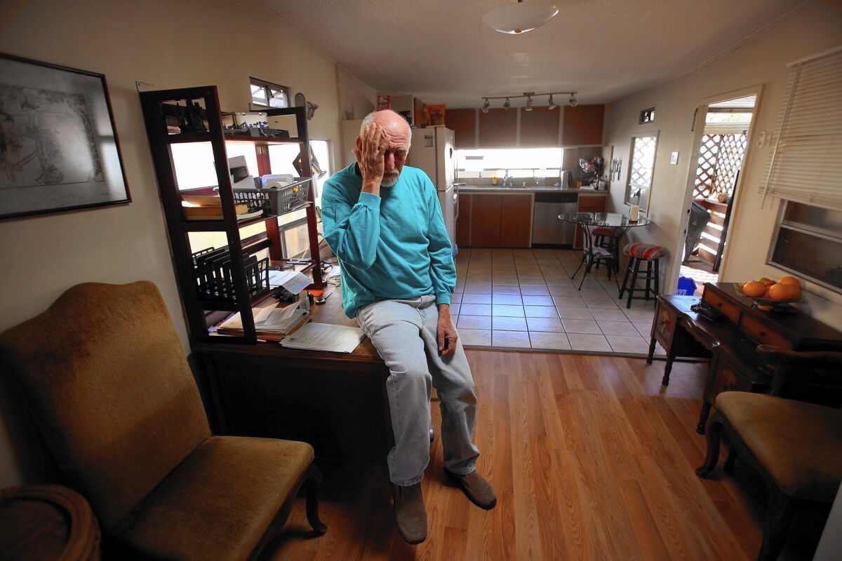 Israel Shachar, 64, in his double-wide mobile home in Culver City. His home is worth much more to him than the $24,050 being offered by a developer.