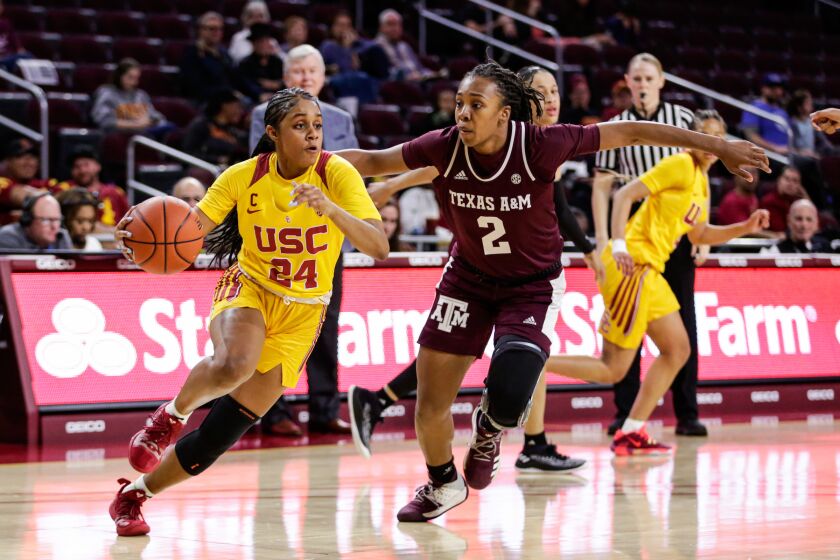 USC's Desiree Caldwell, left, drives past Texas A&M's Aaliyah Wilson on Nov. 23, 2019, at the Galen Center in Los Angeles.