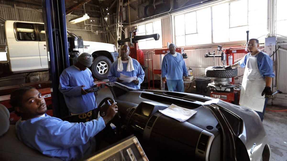 Inmates participate in an auto shop class at Folsom State Prison in Folsom, Calif., where the 50th anniversary of Johnny Cash's celebrated performance that resulted in the "Johnny Cash at Folsom Prison" live album is being marked.