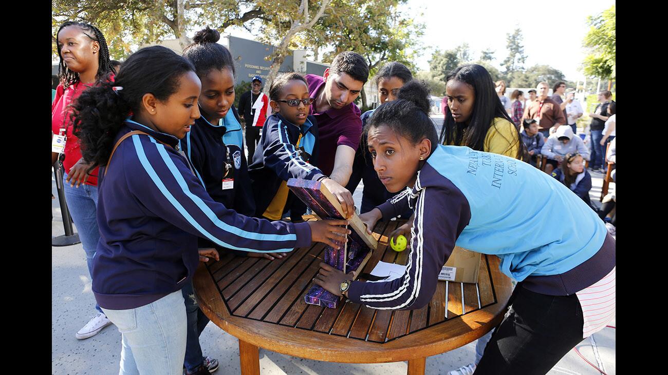 Ethiopia Team One prepares to toss a wiffle ball with their contraption, which won the smallest and lightest entry competition, during their turn at the annual JPL Invention Challenge Wiffle Ball Loft Contest, at JPL in La Cañada Flintridge on Friday, Dec. 1, 2017.