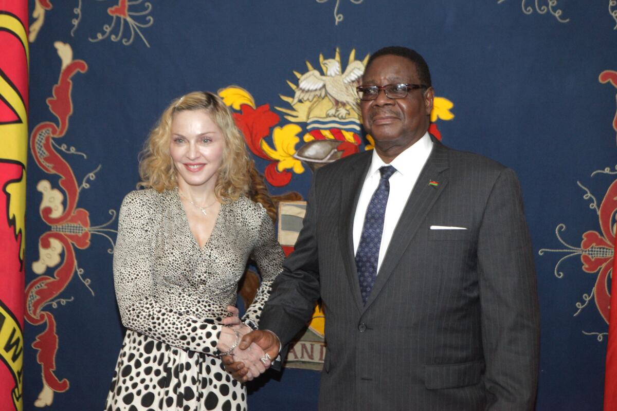 Madonna shakes hands with Malawian President Peter Mutharika at State House in Lillongwe, Malawi, on Nov, 28.