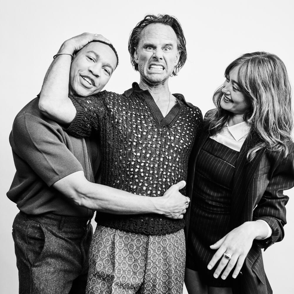 Aaron Moten, Walton Goggins and Ella Purnell clown around for a black-and-white portrait. 