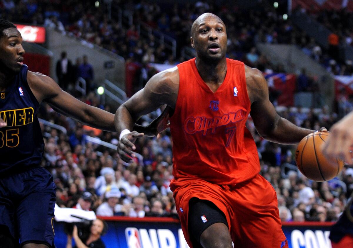 Clippers' Lamar Odom plays against Denver on Dec. 25, 2012.